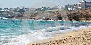 Seascape of the Mediterranean Sea with waves of the turquoise sea on the volcanic coast of Cyprus