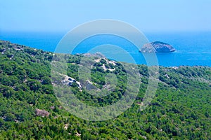 Seascape with Mediterranien sea, rocks and trees on sunny summer day. Summer vacation photo