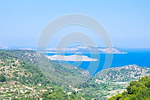 Seascape with Mediterranien sea, rocks and trees on sunny summer day. photo