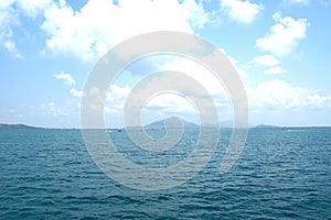 Seascape and Mountain on blue sky