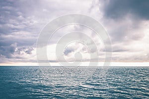 Seascape picture. The sky with clouds, not big waves on the sea surface