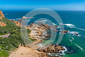 Seascape with picturesque coastline with beach and waves