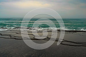 Seascape of rock pools and waves