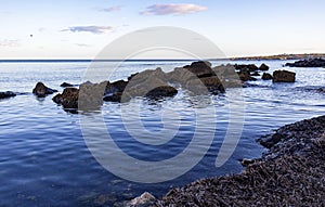 Seascape with rocks near the beach. Horizontal view