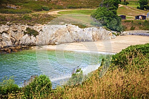 Seascape of romantic and small lapas beach in A Coruna, Galicia, Spain photo