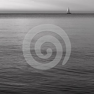 Seascape with a sailboat - evening shore in Gdynia, Tricity, Poland