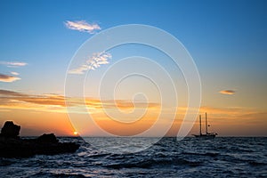 Seascape with sailing boat on sunrise in Majorca