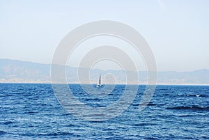 Seascape. Sailing vessel. View of Sicily, Italy