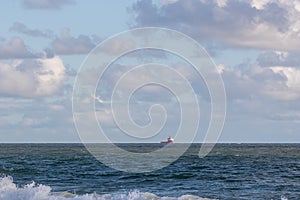 Seascape. Ship on the ocean horizon