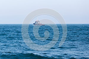 Small auxiliary ship goes to sea photo
