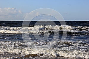 Seascape during a storm with big waves, close-up, Carnikava, Latvia. Big and powerful sea waves during the storm