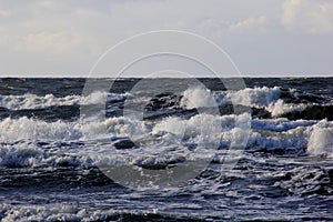 Seascape during a storm with big waves, close-up, Carnikava, Latvia. Big and powerful sea waves during the storm