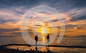 seascape the sunset and light gold with fisherman silhouette foreground on island in Thailand