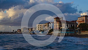 Seascape, sunset over the Tuscan town of San Vincenzo, Italy