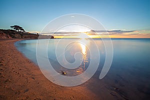 Seascape of Sunset overlooking house on a cliff