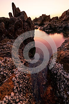 Seascape during sunset or sunrise light of nature. Amazing Natural seascape with rocks in the foreground Beautiful composition of