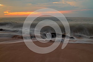 Seascape. Sunset time at the beach. Ocean with strong waves. Tegal Wangi beach, Bali, Indonesia