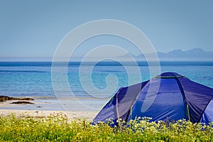 Seascape with tent on beach, Lofoten Norway