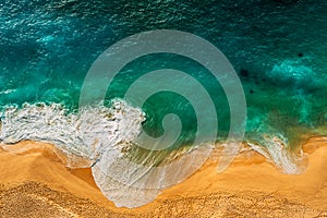 Seascape top view. Panoramic view of the sea waves. Foamy waves roll over the seashore. A vivid picture of marine nature.