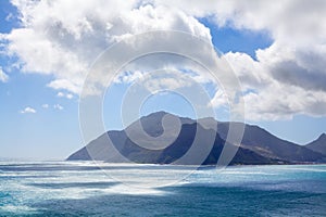 Seascape turquoise ocean water, blue sky, white clouds panorama, mountains view landscape, Cape Town, South Africa coast travel