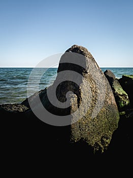 Seascape with Two Glacial Boulders Covered with Seaweed