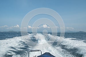 seascape view from the back of a ship that runs off the shore