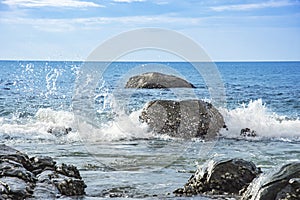 Seascape and water splash the stone