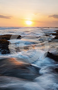 Seascape, wave and horizon in sunset