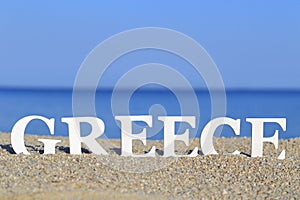 Seascape with white word Greece