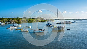 Seascape with yacht and boat on the blue ocean of harbour at serangan island bali