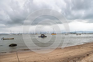 Seascape with yachts on the calm sea at Santo Antonio de Lisboa, Florianopolis, Brazil