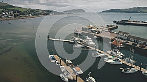 Seascape with yachts, ships on harbor. Aerial cityscape with modern buildings at downtown streets