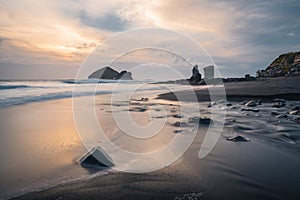 Seascapes at sunset, with rocks on the sea surface. Mosteiros Beach on Sao Miguel Island, Azores, Portugal