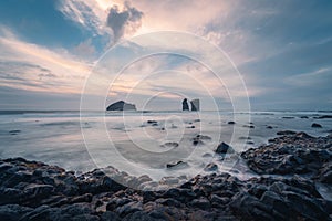 Seascapes at sunset, with rocks on the sea surface. Mosteiros Beach on Sao Miguel Island, Azores, Portugal