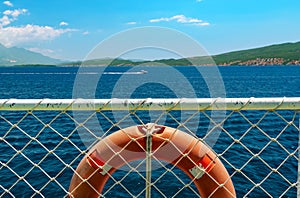 seascapes, view from deck of ship with lifebuoy, the Bay of Kotor during a cruise on a ship in Montenegro, a bright sunny day,