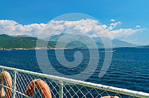 seascapes, view from deck of ship with lifebuoy, the Bay of Kotor during a cruise on a ship in Montenegro, a bright sunny day,