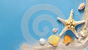 Seashell, starfish and beach sand on blue background