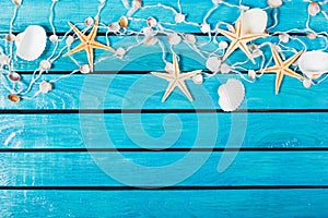 Seashells On Blue Wooden Background with place for