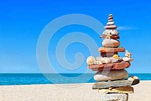 Seashells and rock Zen on the background of sea and blue sky