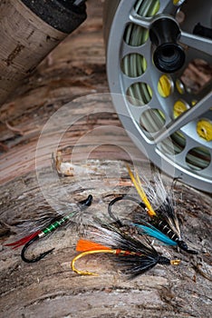 Colourful fly fishing flies on natural background