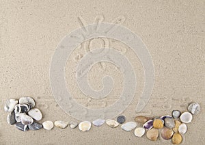 Seashells and stones with a pattern of sand for relaxation as a background