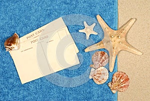 Post card beach towel starfish seashells copy space