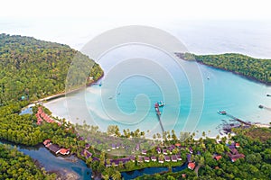 Seashore blue ocean with green tree forest