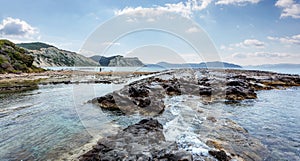 Seashore with cliffs, A scenic landscape photo of the beautiful Corfu island coastline. Wonderful view of Kanoula beach. Greece.