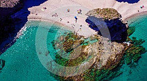 Seashore, coastline, scenic view of people at unspoiled beach in Almeria, called Playa de los Muertos,