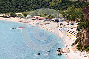 Seashore with Jaz beach in Budva municipality in Montenegro. Aerial view of coast of Adriatic sea. Europe