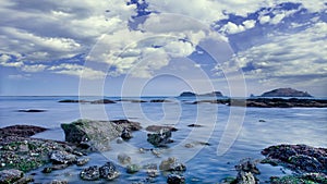 Seashore with rocks and dramatic clouds, Dalian, China