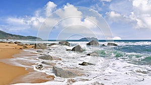 Seashore with rocks and waves at tropical Sanya, Hainan, China