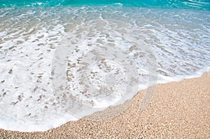 Seashore, waves and sandy beach