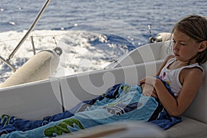 Seasick girl on sailing boat